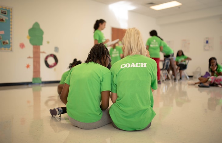 Coach and girl sitting together Coach and girl sitting together